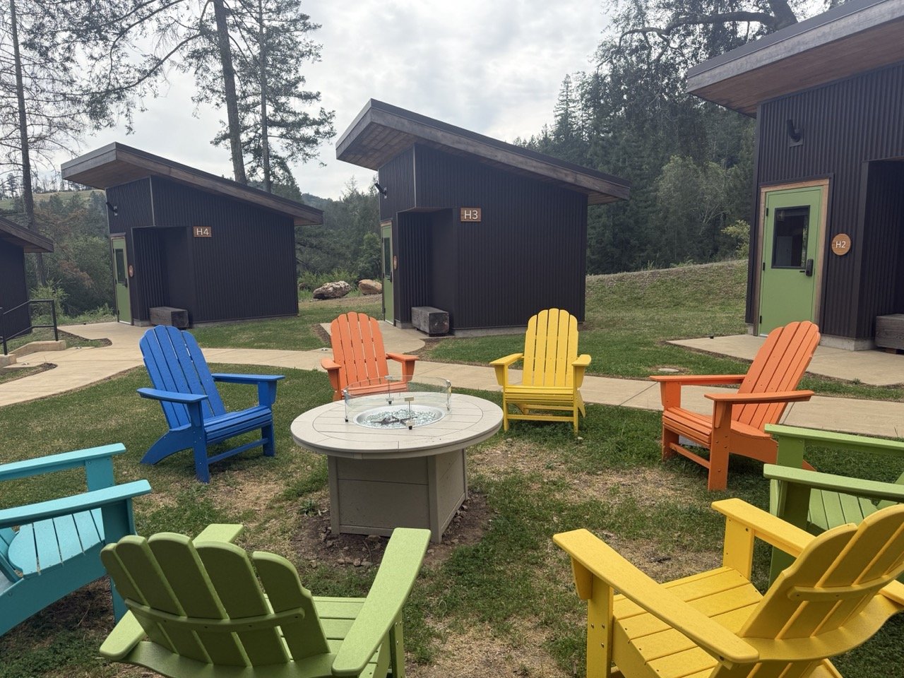The casitas at Camp Coffee Shop next to a communal sitting area. The casitas feature queen beds.