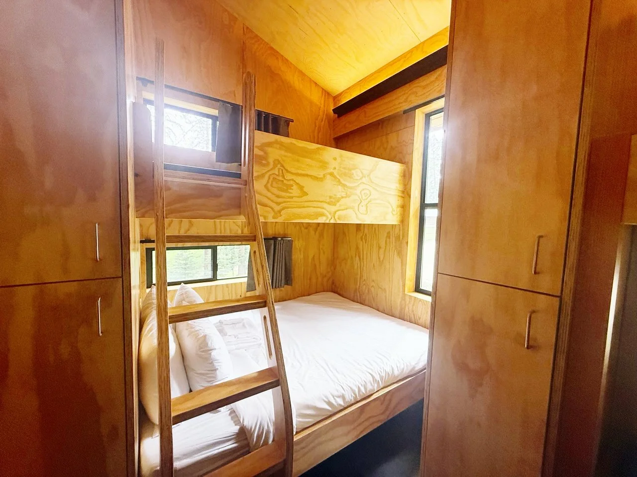 The interior of a Bunkhouse at Camp Coffee Shop. The Bunkhouses were all built with reclaimed wood.