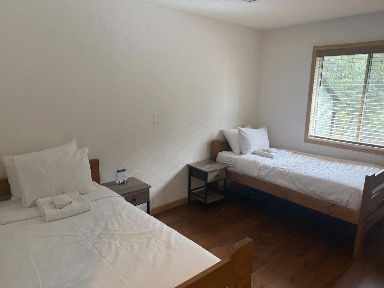 A Twin Room in the historic Lodge at Enchanted Hills with two beds.
