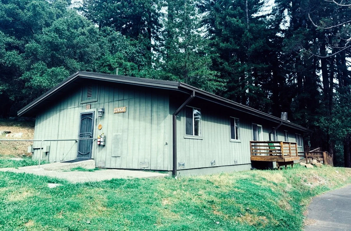 The Lodge at Enchanted Hills. One of the buildings that survived the wildfire, the Lodge has several Twin Rooms, some with balconies, available for Camp Coffee Shop Attendees.