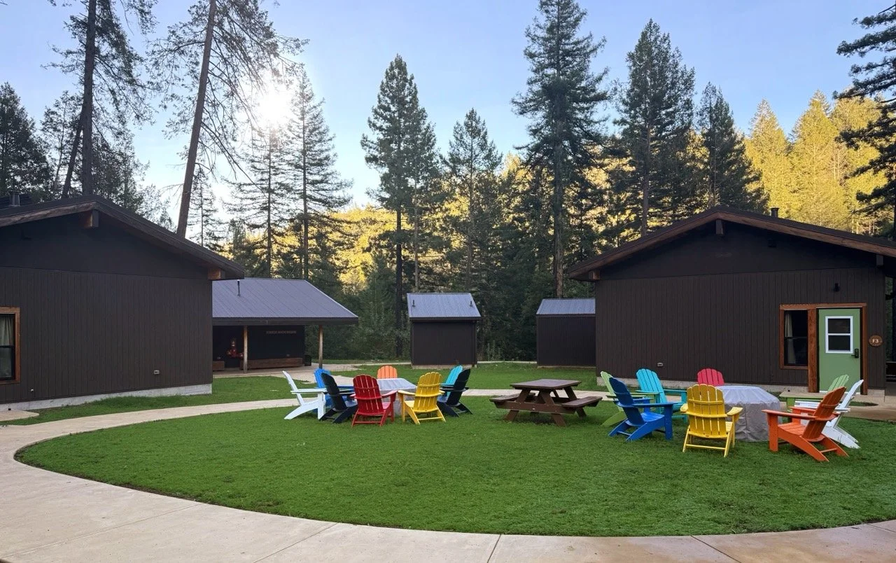The Bunkhouses at Camp Coffee Shop with chairs for socializing around the campfire.