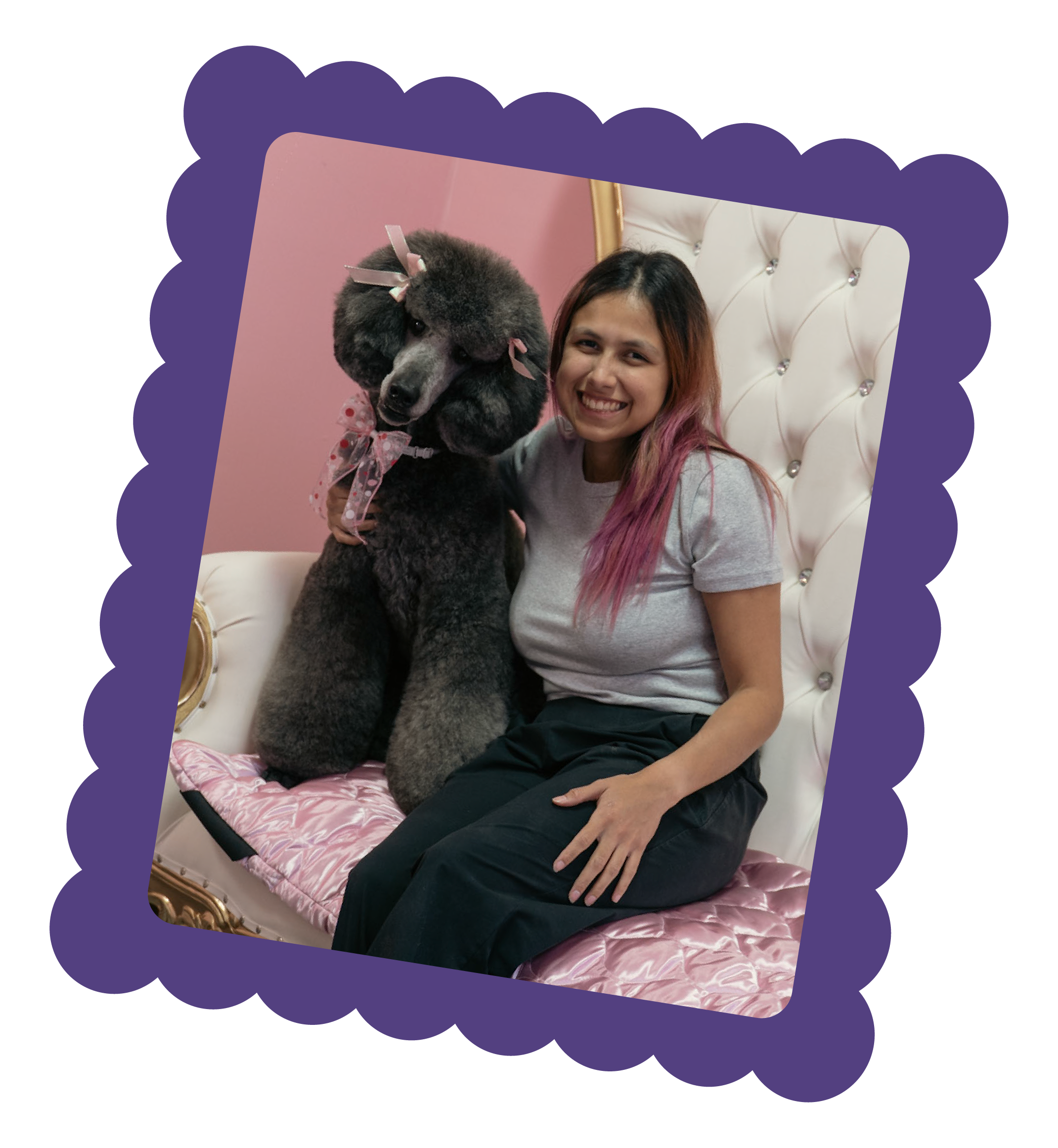 Alisa, owner of Topknot Pet Salon & Spa, posing with a freshly groomed poodle client in Los Angeles, California