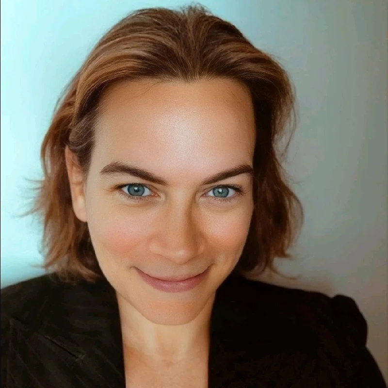 Close-up of a woman with shoulder-length brown hair