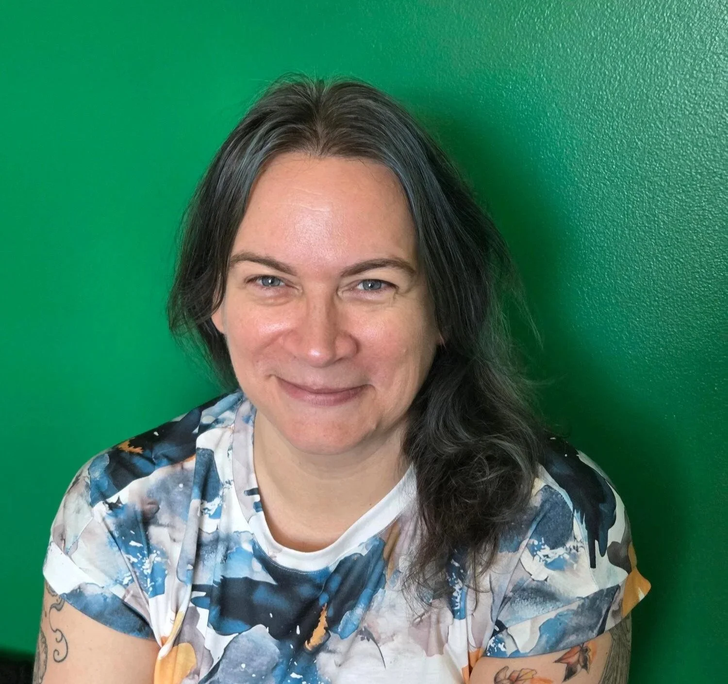 Close-up of a woman with shoulder-length brown hair