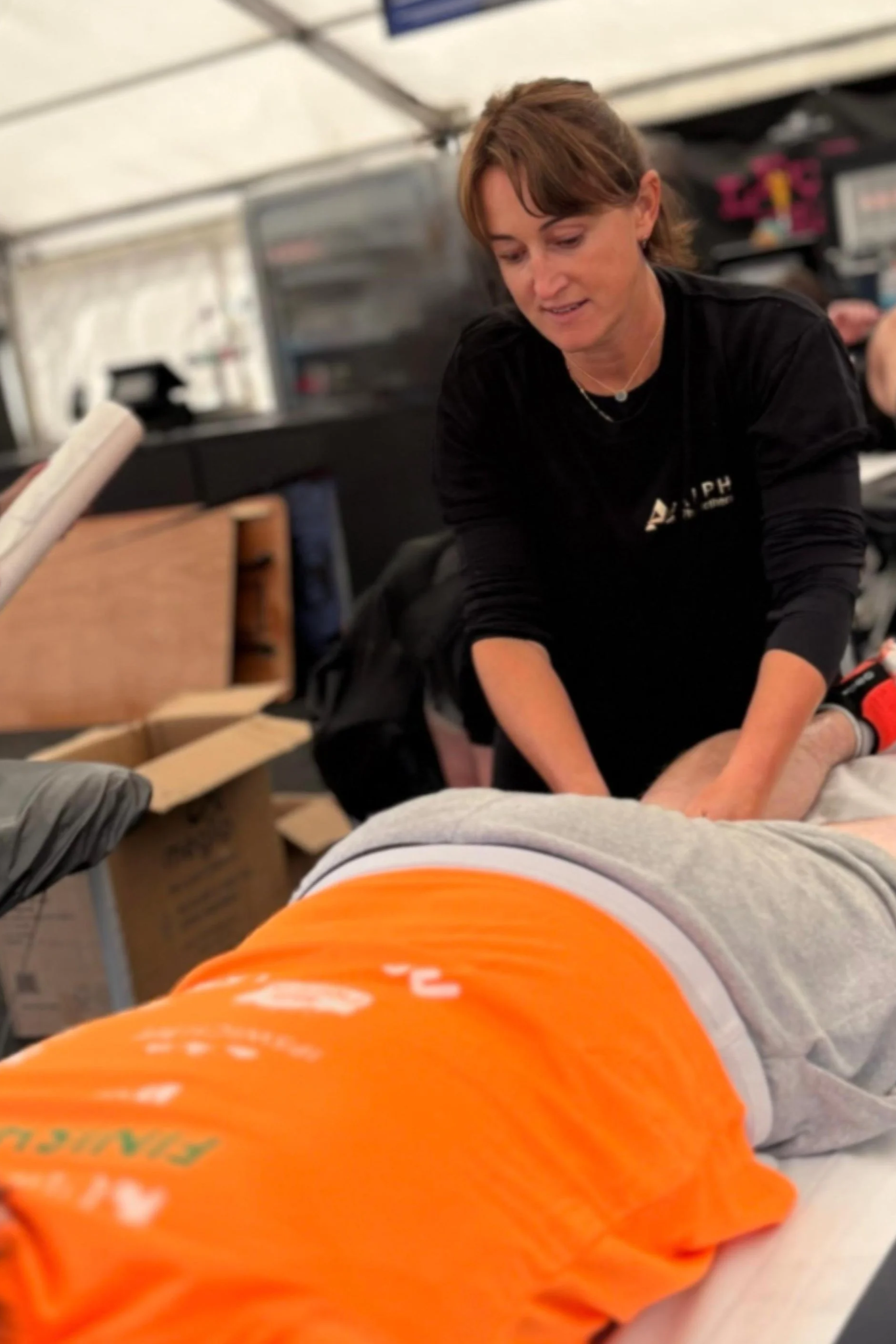 Clare providing post race sports massage to a half marathon runner