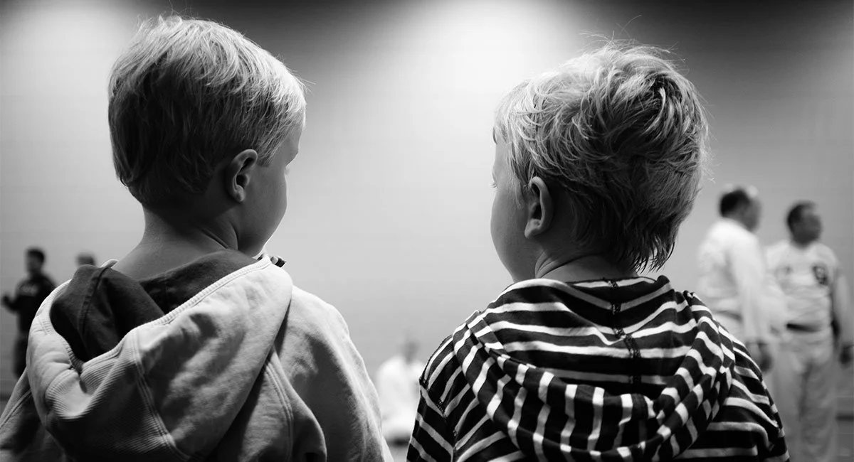 Black and white image of two children sitting together