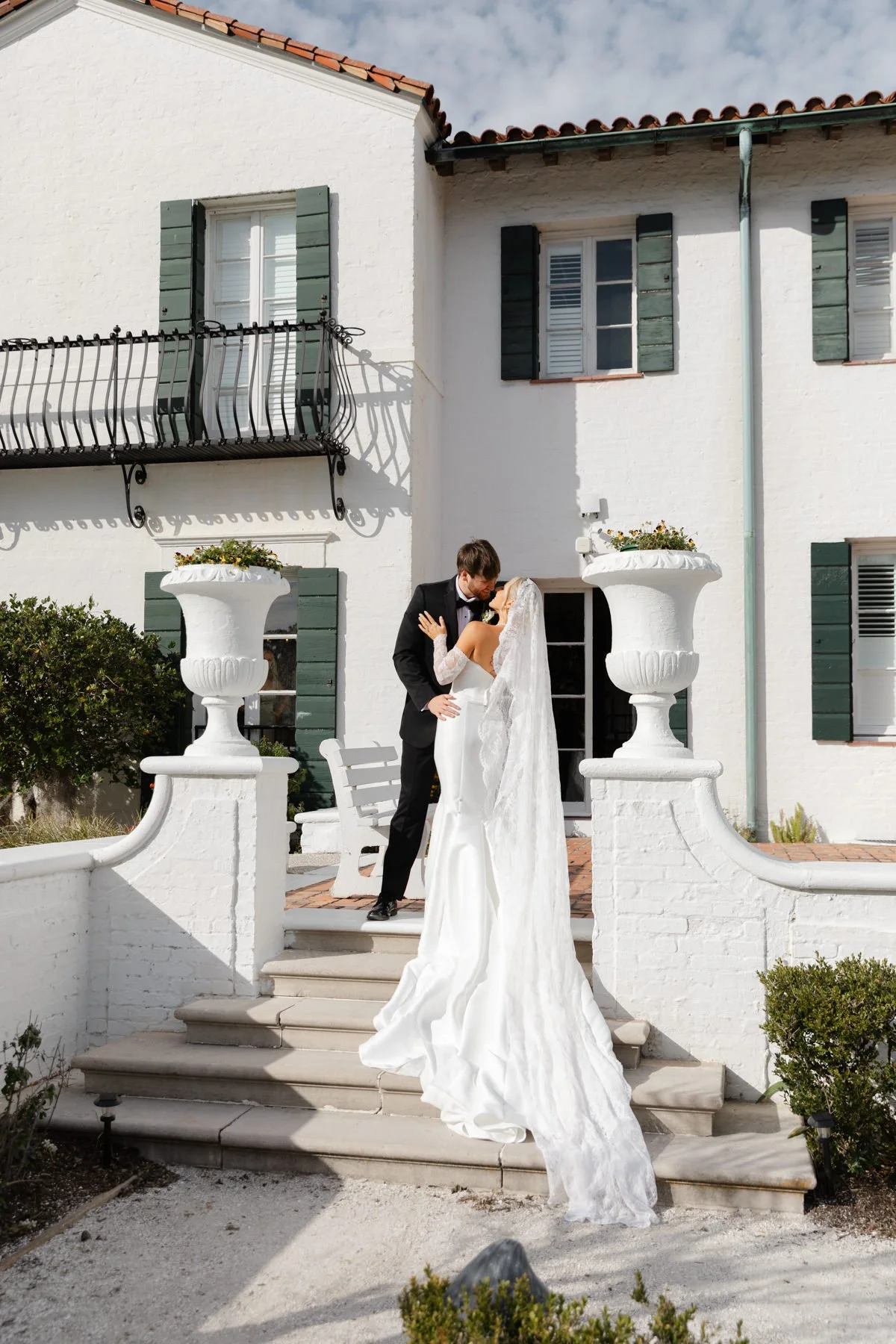 Bride and groom at the top of a staircase in the Golden Isles