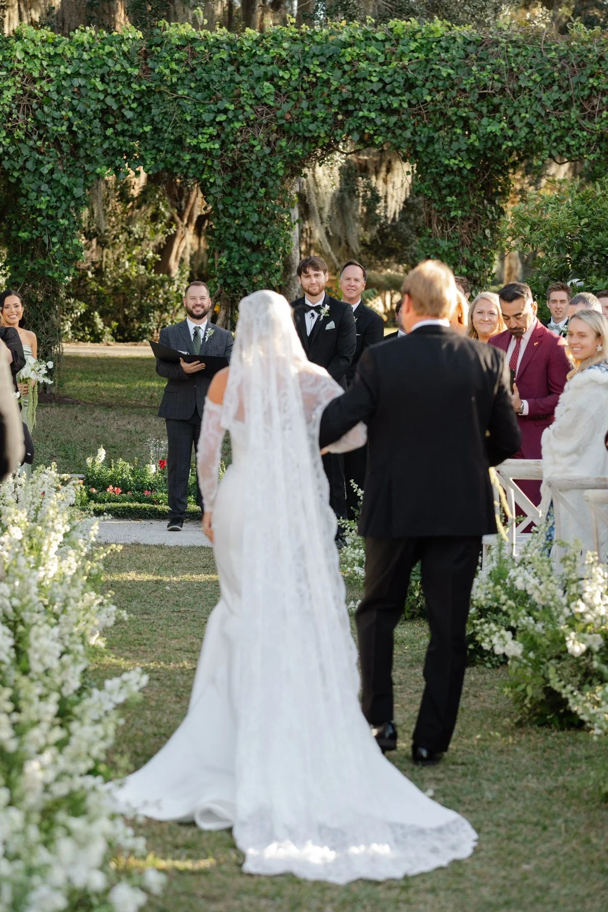 Bride walking down the aisle with her father in coastal Georgia