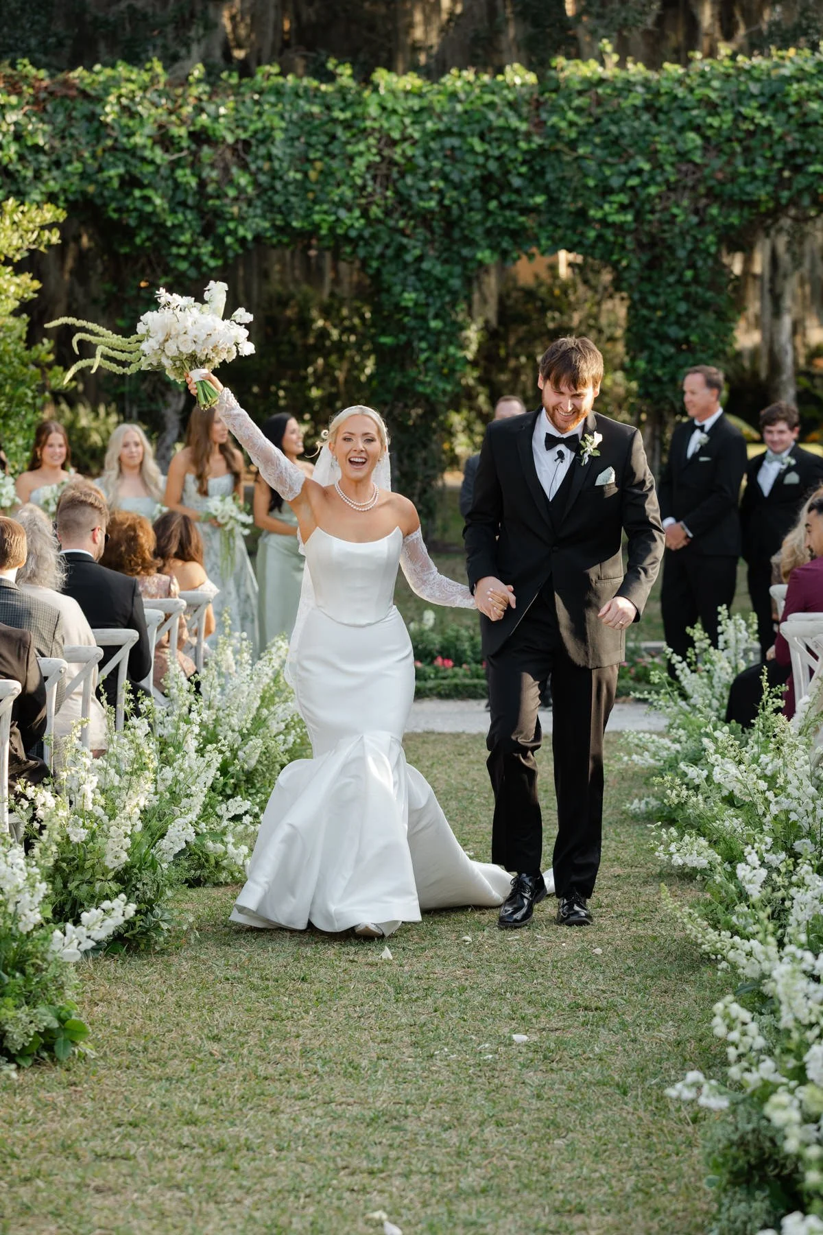 Bride and groom walking back down the aisle after the ceremony