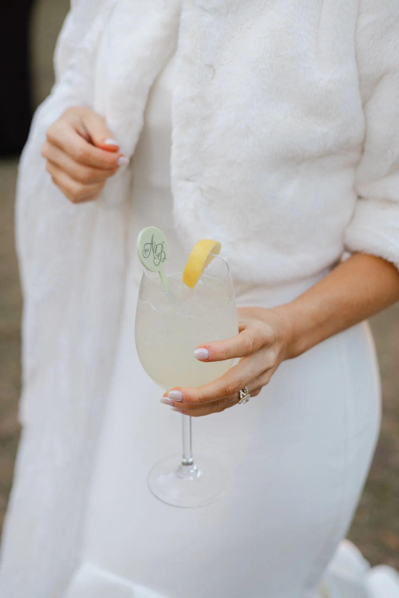 Bride holding signature drink at reception on St Simons Island