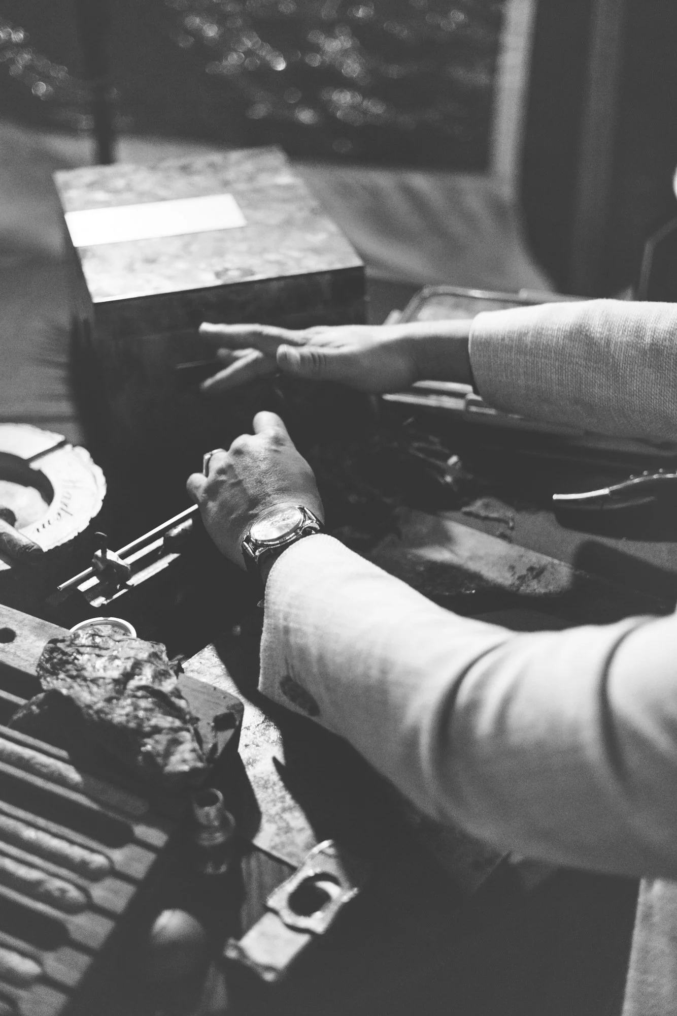 Black and white cigar rolling detail at a Sea Island wedding