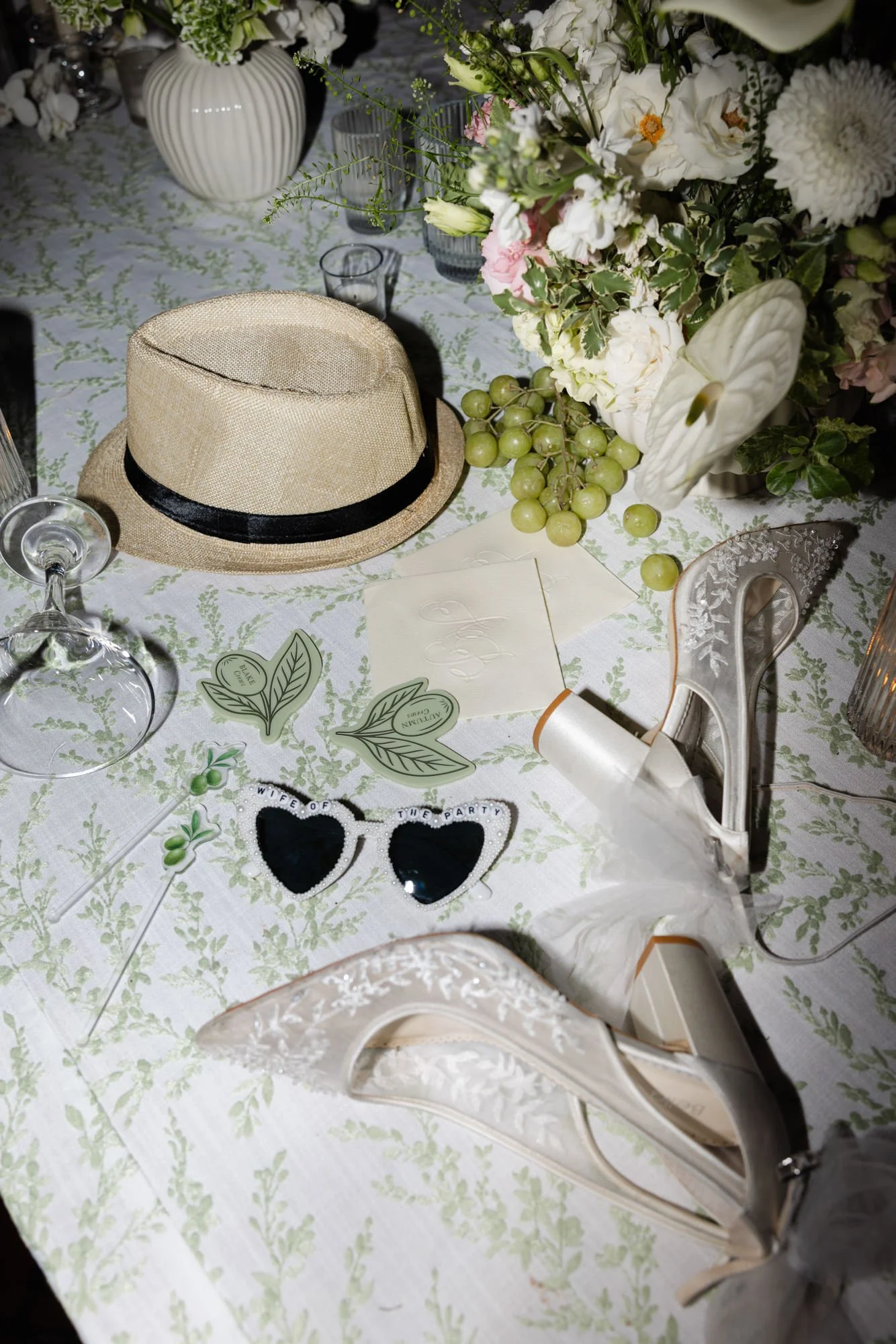 Editorial reception details with fun props at a Mediterranean wedding