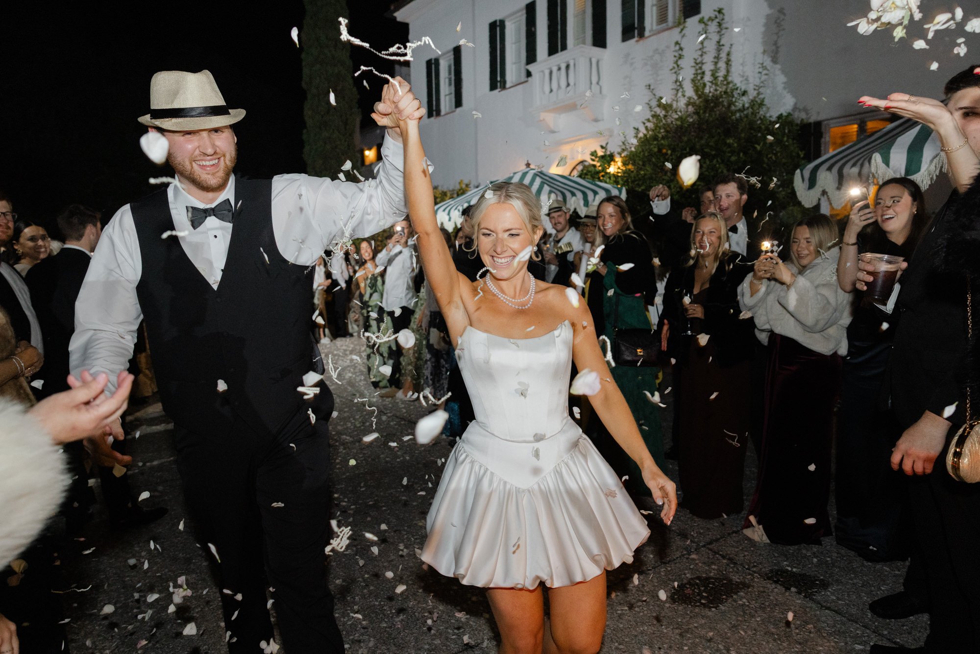 Bride and groom petal exit at Crane Cottage on Jekyll Island