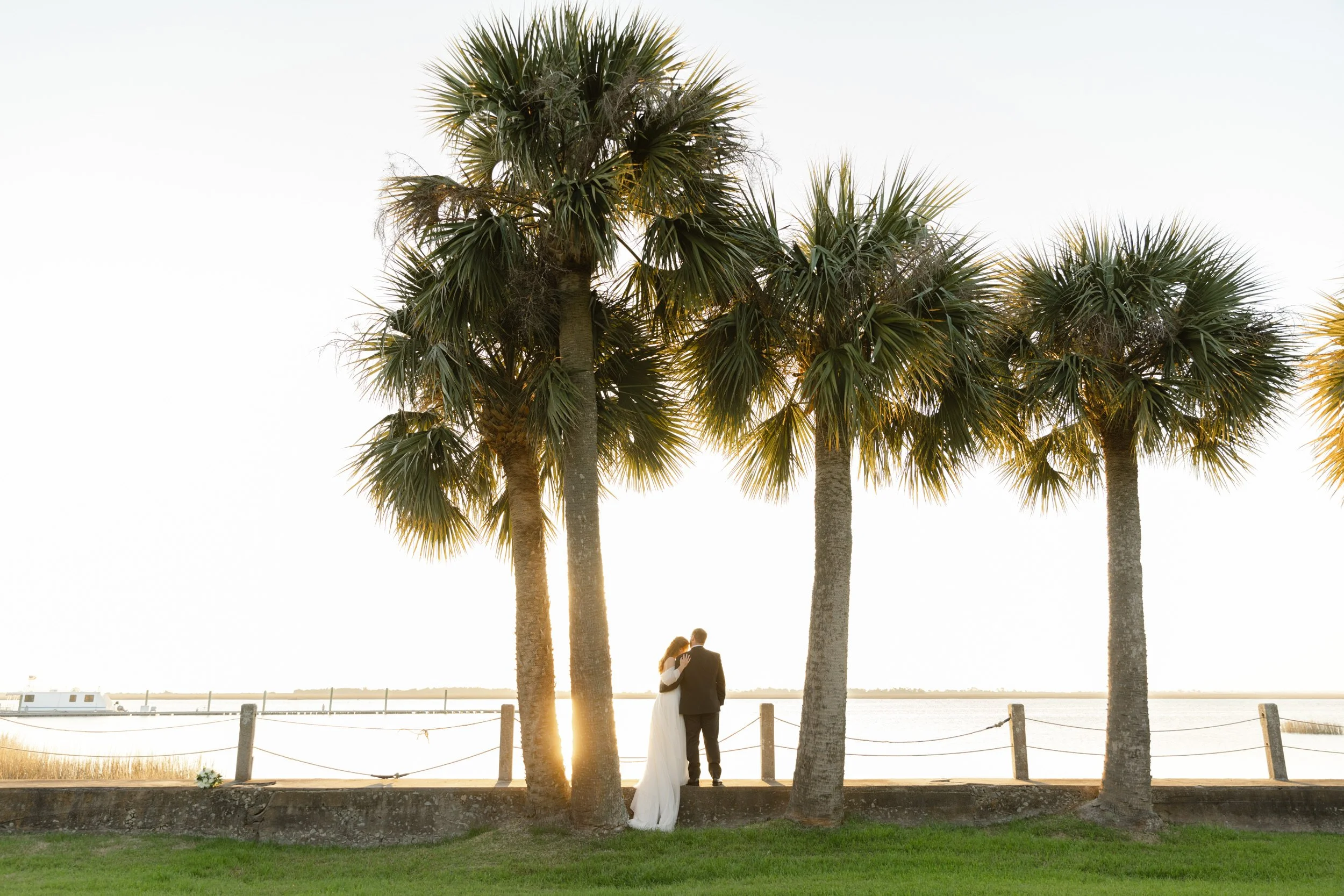 Bride and groom overlooking a marsh view on Jekyll Island during their coastal Georgia wedding.