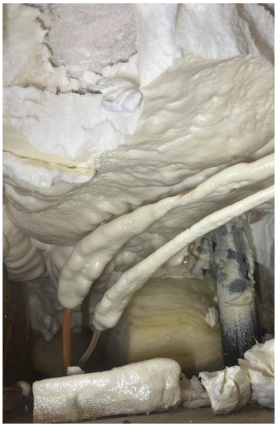 Sample of what condos are up against when repipe using traditional methods.  Kitec pipe buried in the spray foam insulation
