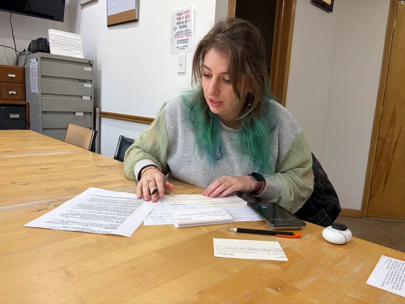 A CCM volunteer on a phone call as part of a medical session.