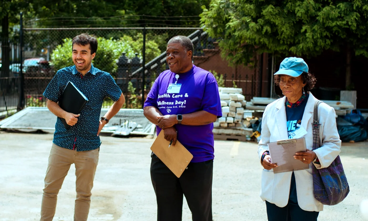 Three volunteers enjoying themselves outside before a volunteer activity.