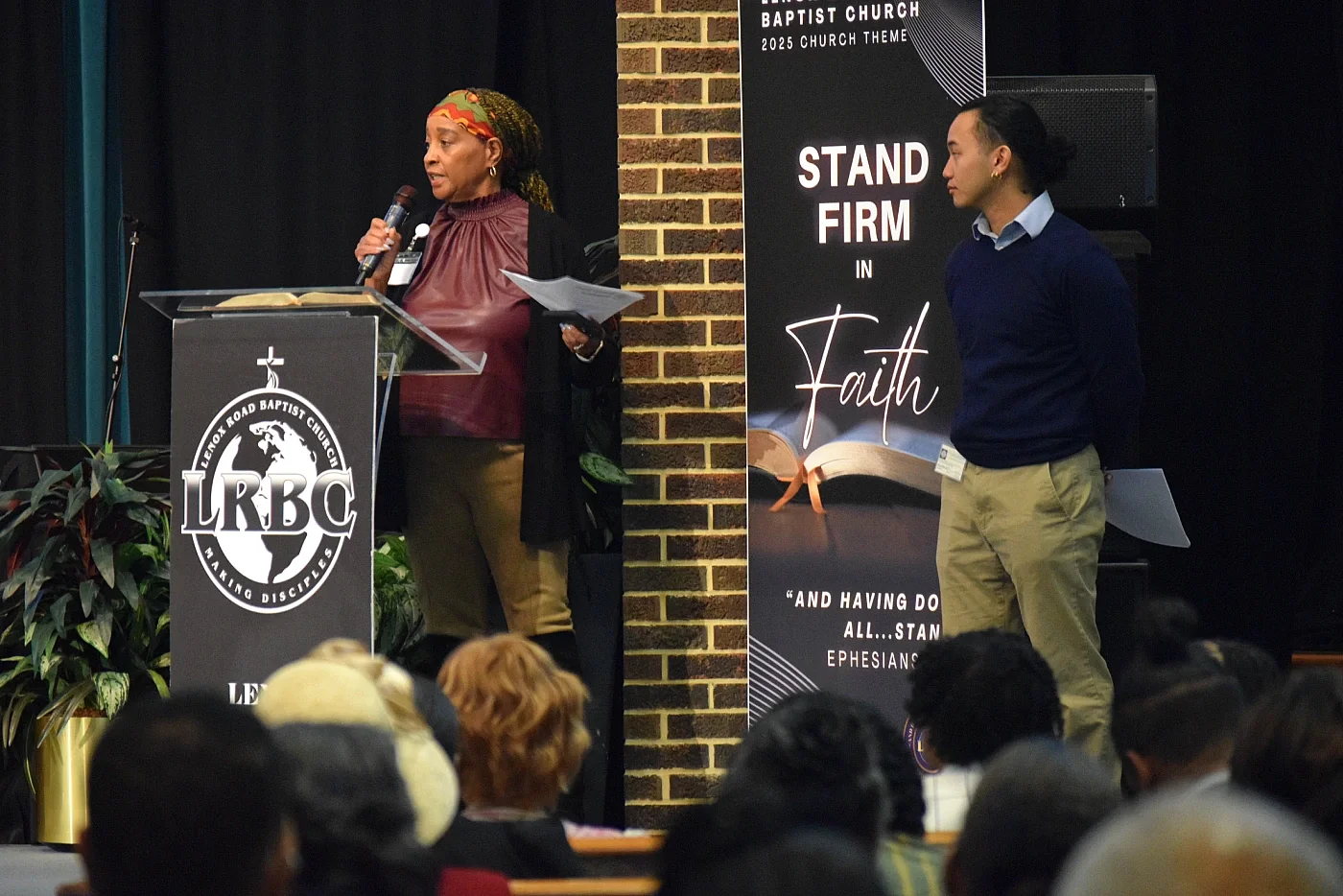 Two CCMP organizers speak to a church about CCMP's work. 