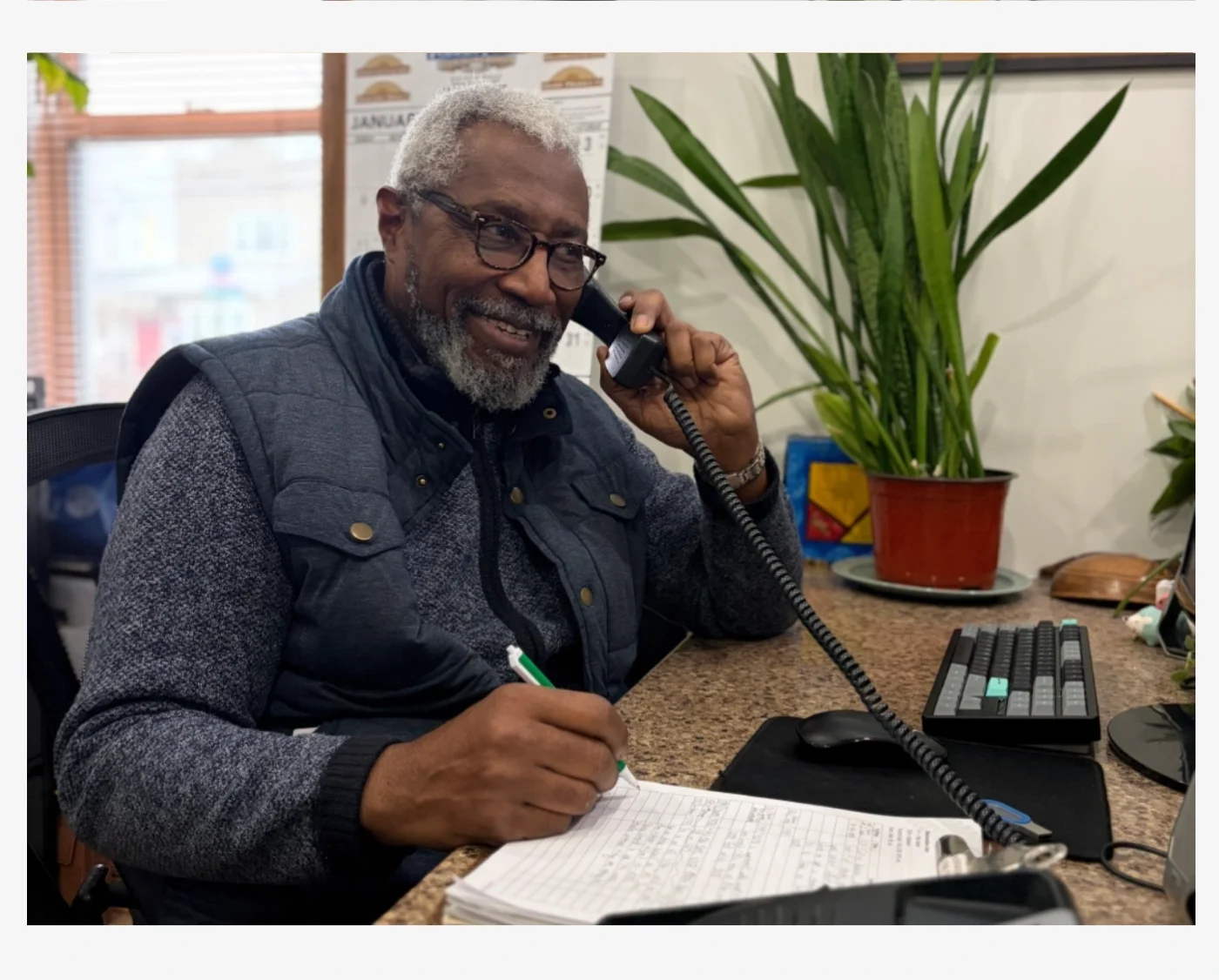 A volunteer answering the phone.