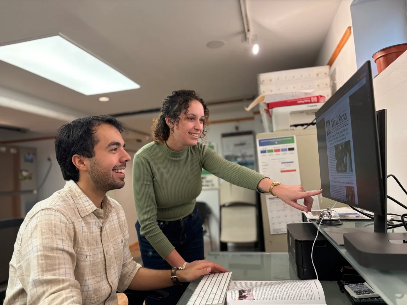 A CCMP organizer and volunteer work on a CCMP publication.