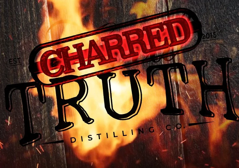 A fiery logo for Charred Truth Distilling Co. with the word "Charred" stamped in red over the word "Truth" on a dark wooden background with sparks.