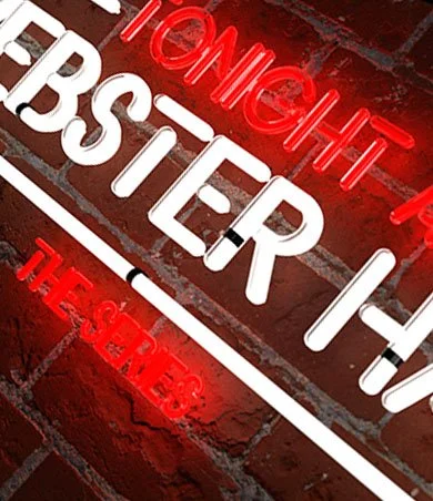 Webster Hall Neon Logo against a brick wall