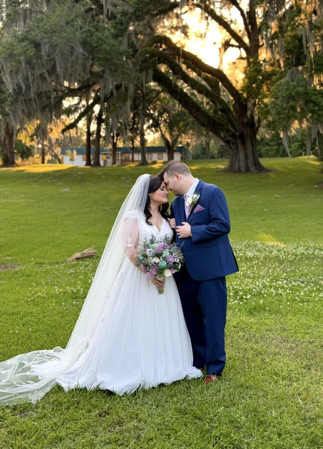 bride and groom in the oak trees