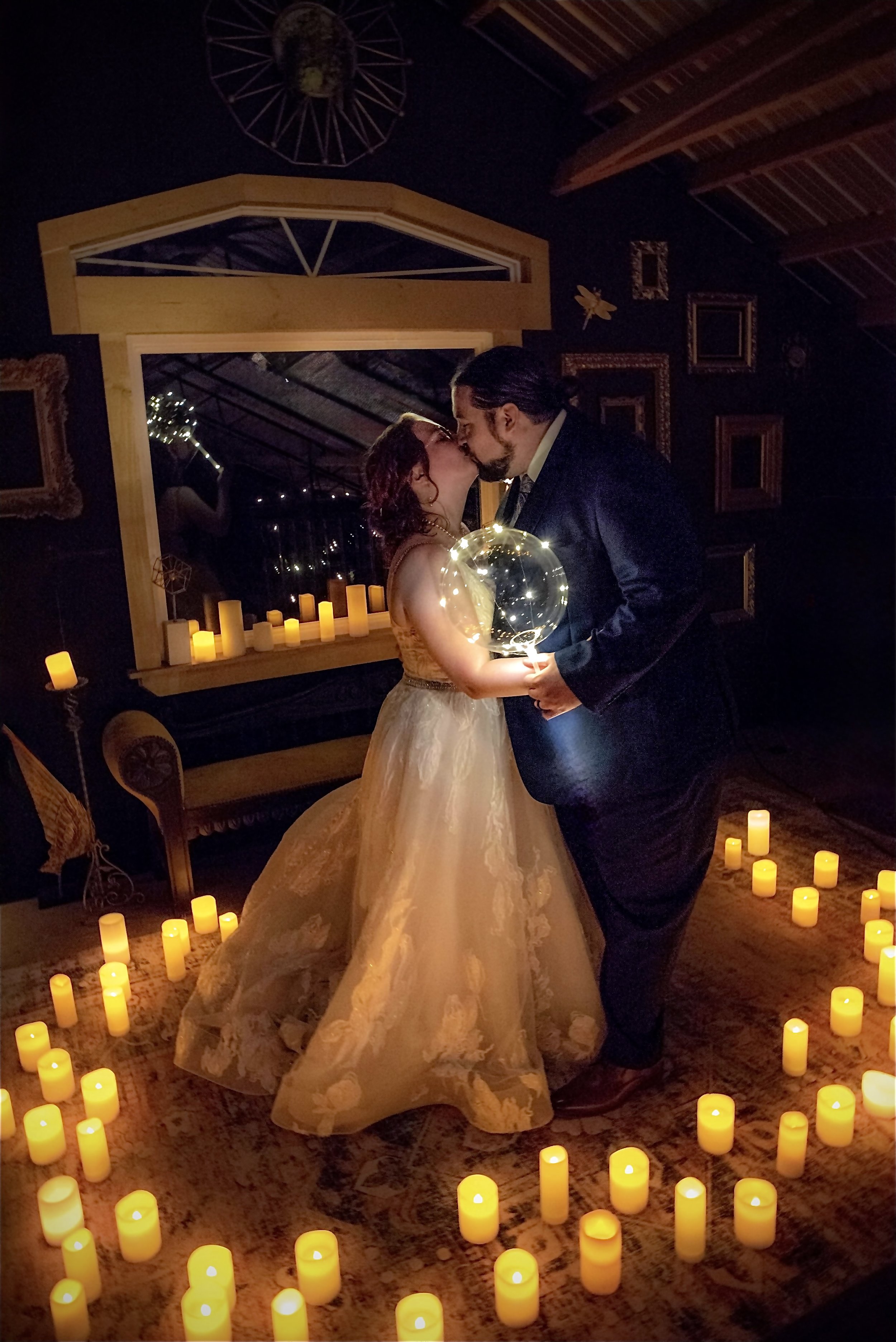 kiss surrounded by candles 