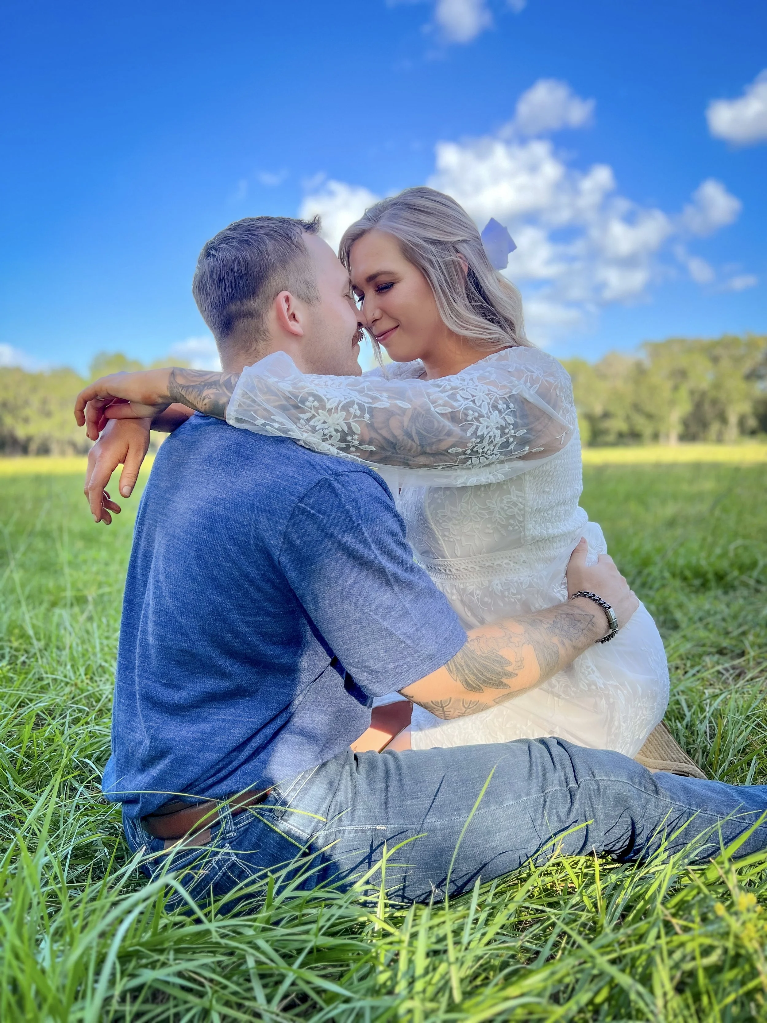 couple kneeling in the grass