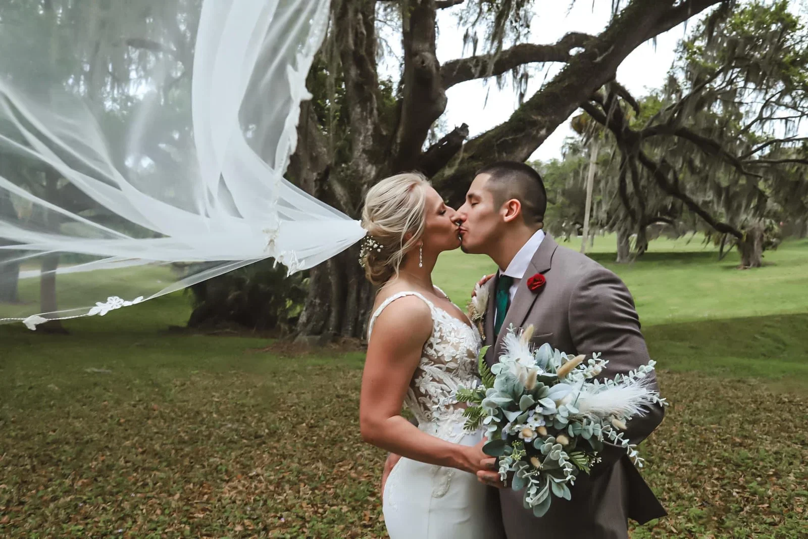 bride and groom kiss