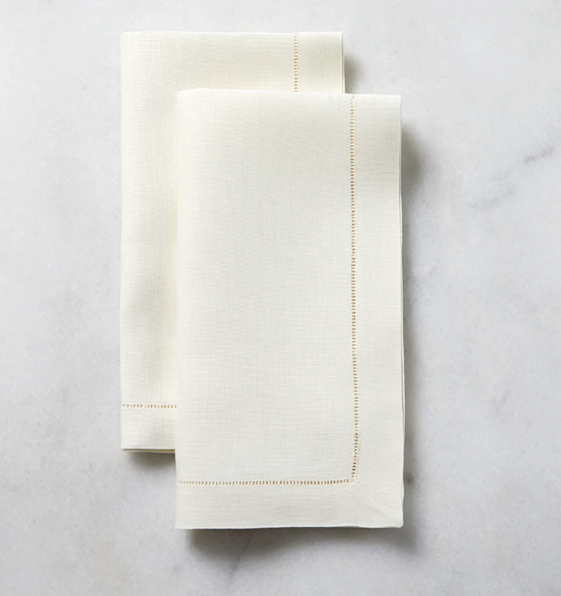 Sferra Classico Napkins in Ecru on a marble table