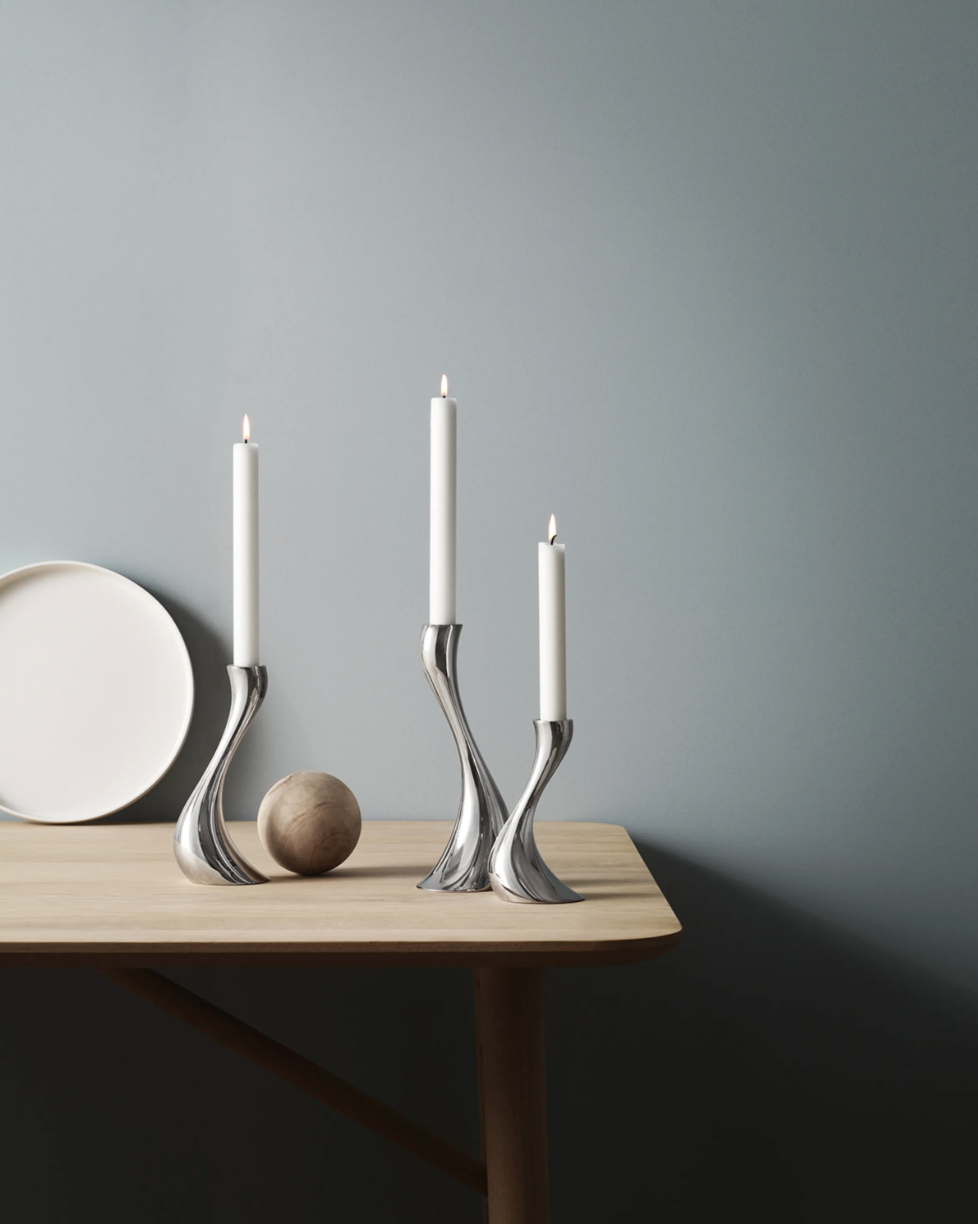 Georg Jensen Cobra Medium Candle Holders on a blond wood table