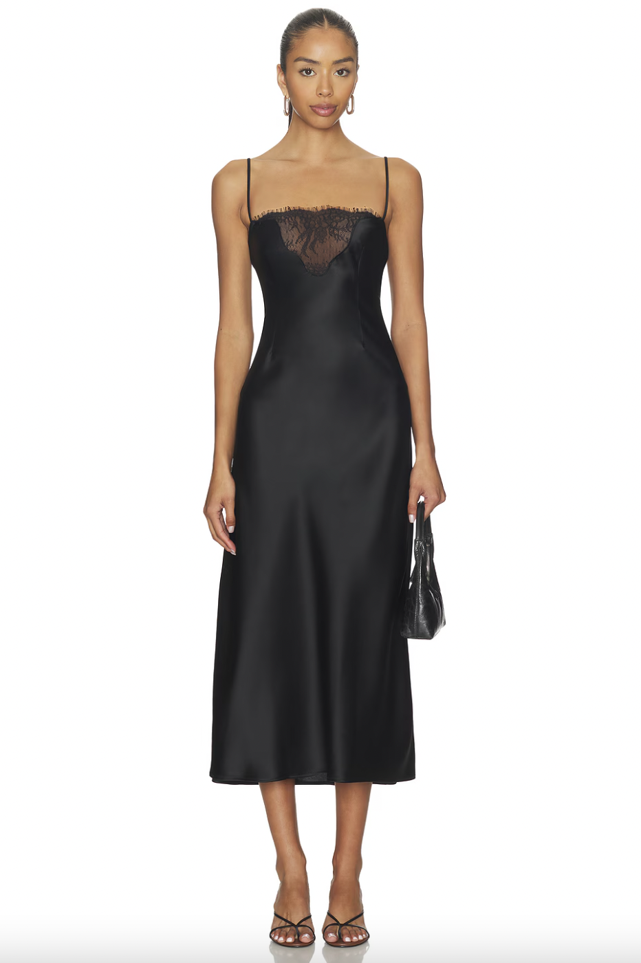 Model wearing the Eaves Sigrun Maxi Dress in black with black sandals