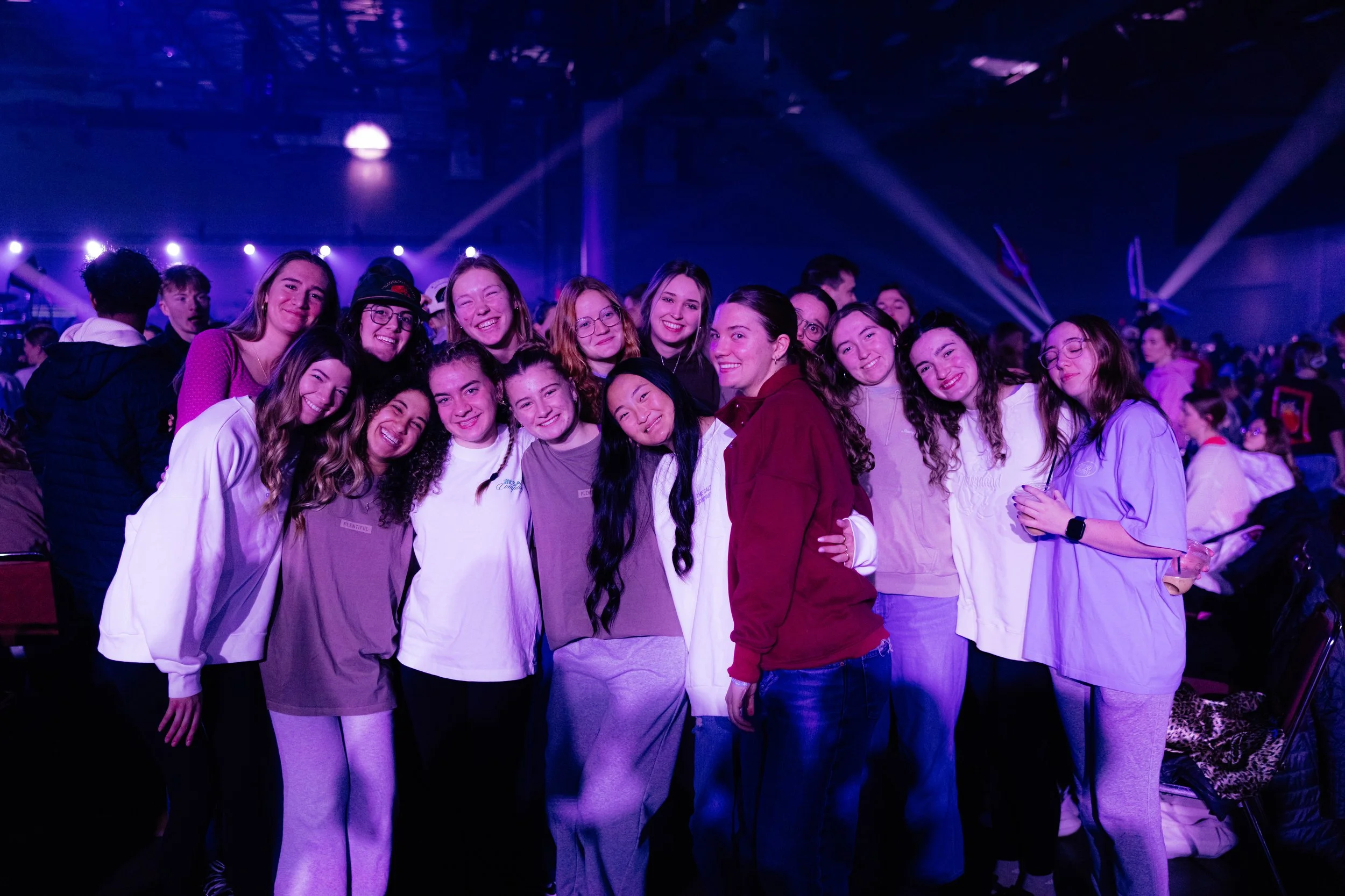 A group of young women posing together at salt conference.