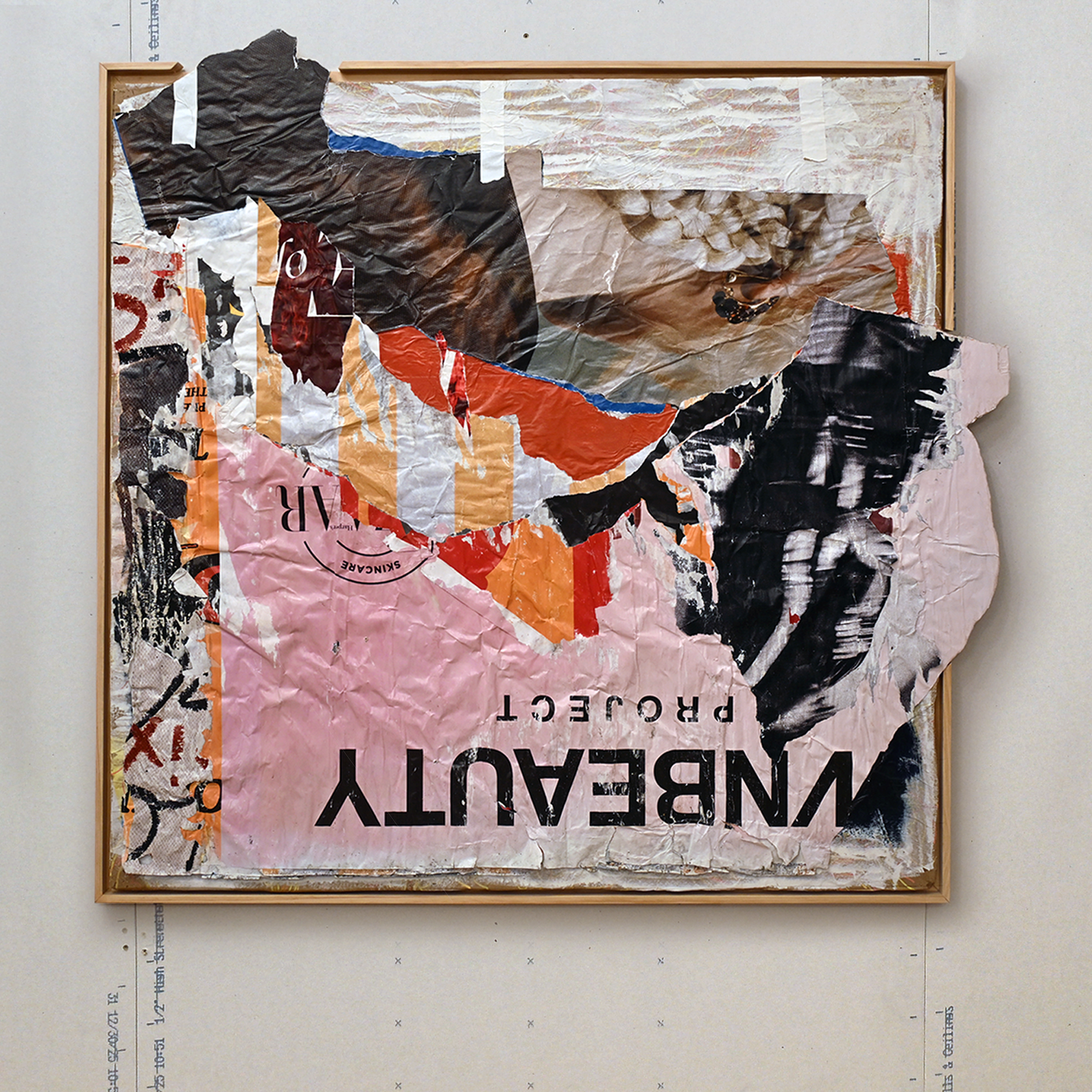 Mixed media collage artwork with torn paper and text
