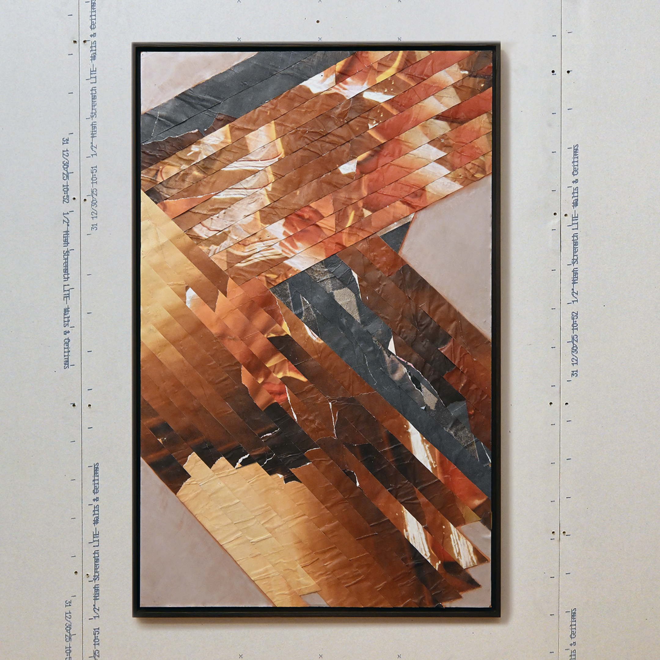 Abstract sepia and navy colored collage artwork with diagonal strips of various shades of brown, black, and beige.