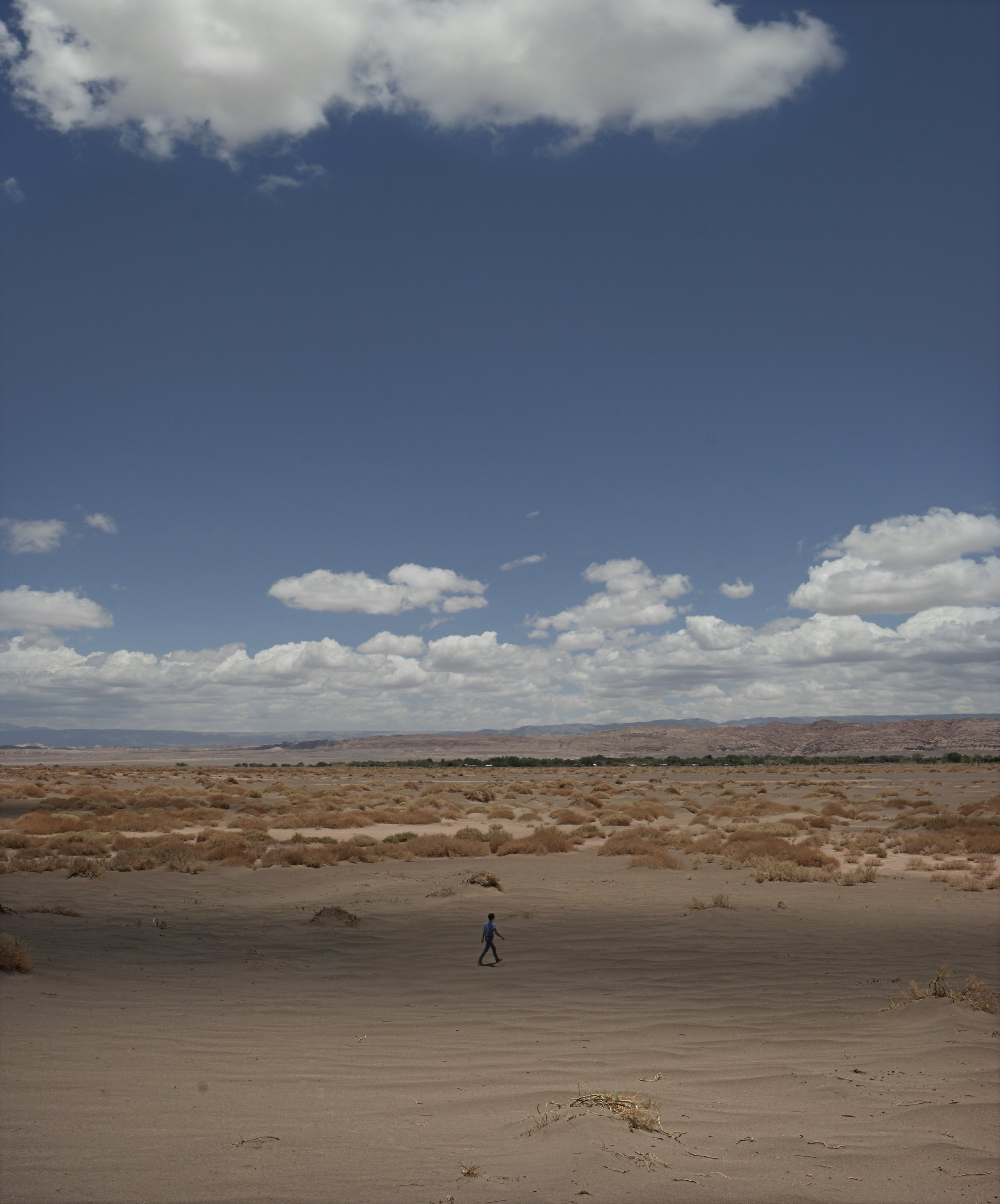Artwork on the topic of landscape consciousness, which shows the synchronicity between humans and nature. Photographic work by artist Oscar Santillan. Photograph taken at the Atacama Desert