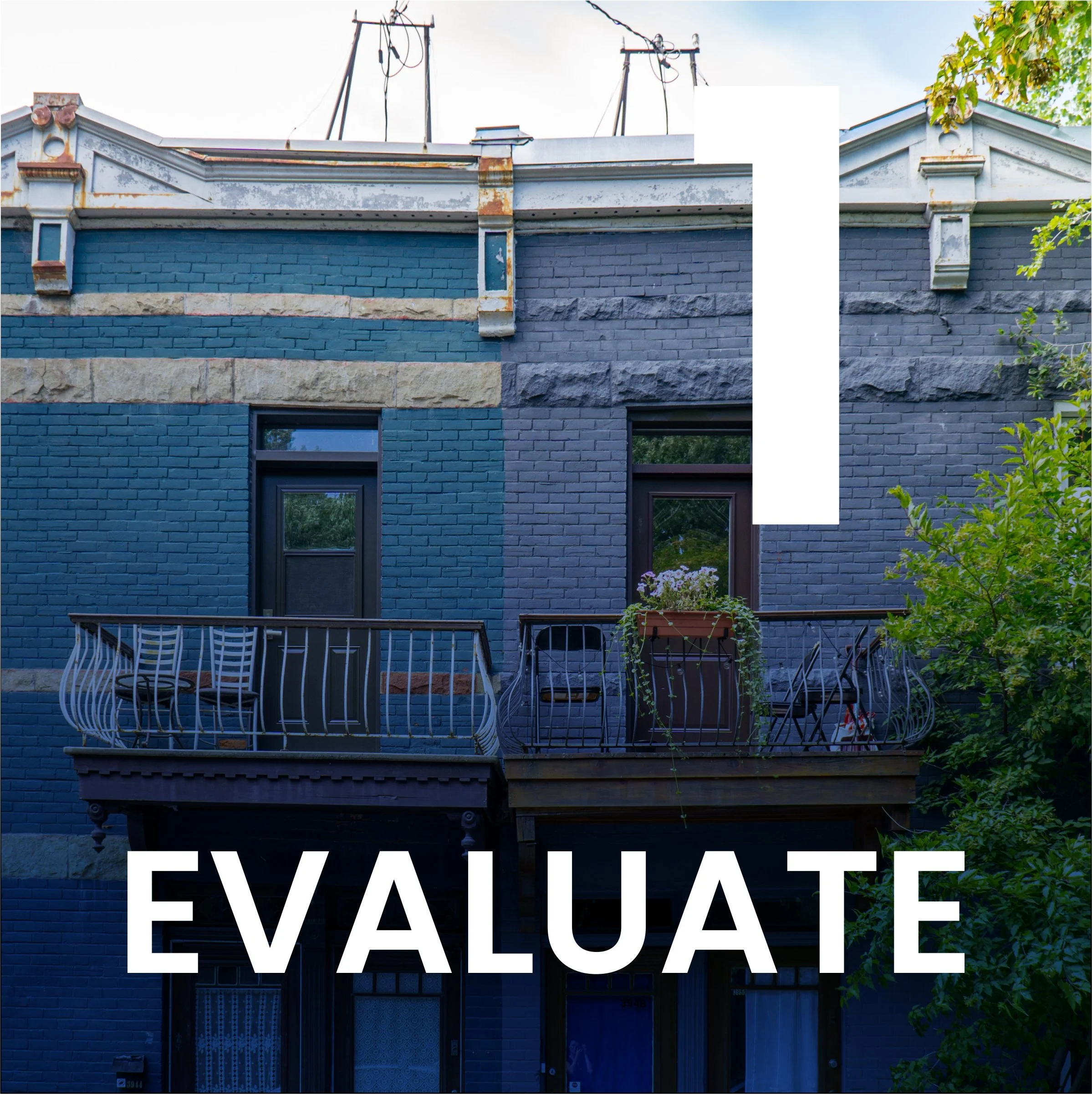 A blue brick building with a balcony and a large sign that reads 'EVALUATE' partially visible.