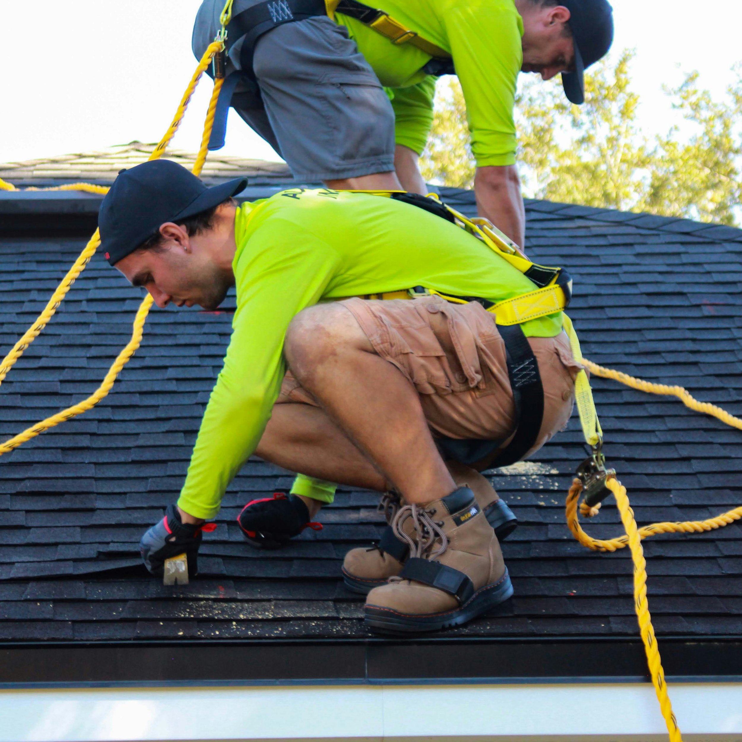 workers-on-roof-removing-damaged-shingles.jpg