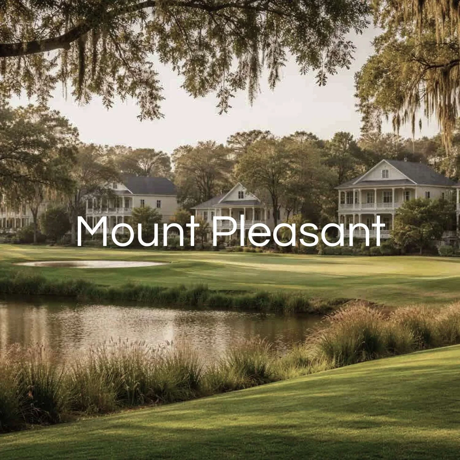 Scenic view of Mount Pleasant neighborhood with large houses, trees, a pond, and a golf course in the foreground during daytime.