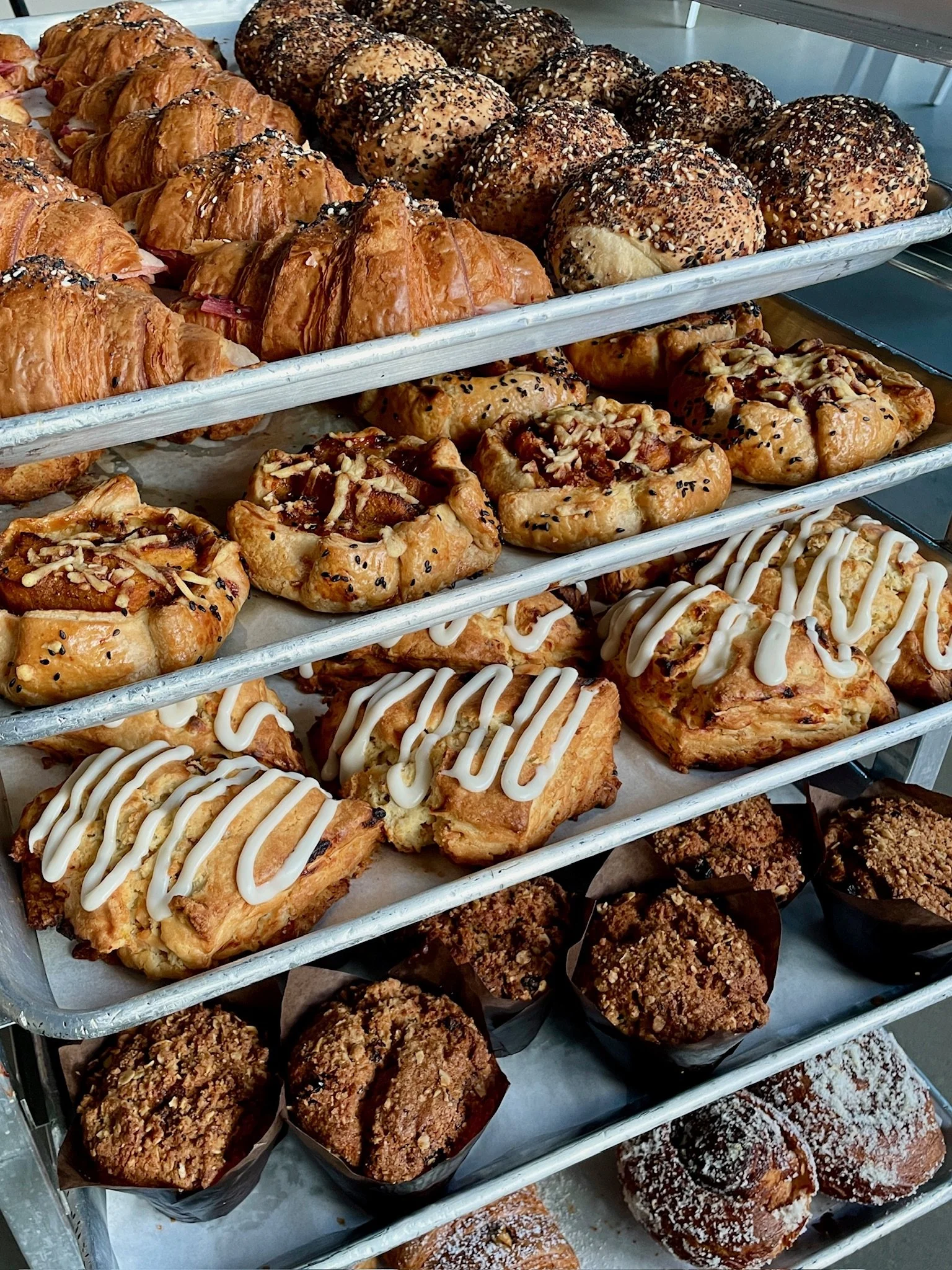 BAKERS RACK FULL OF ASSORTED PASTRIES