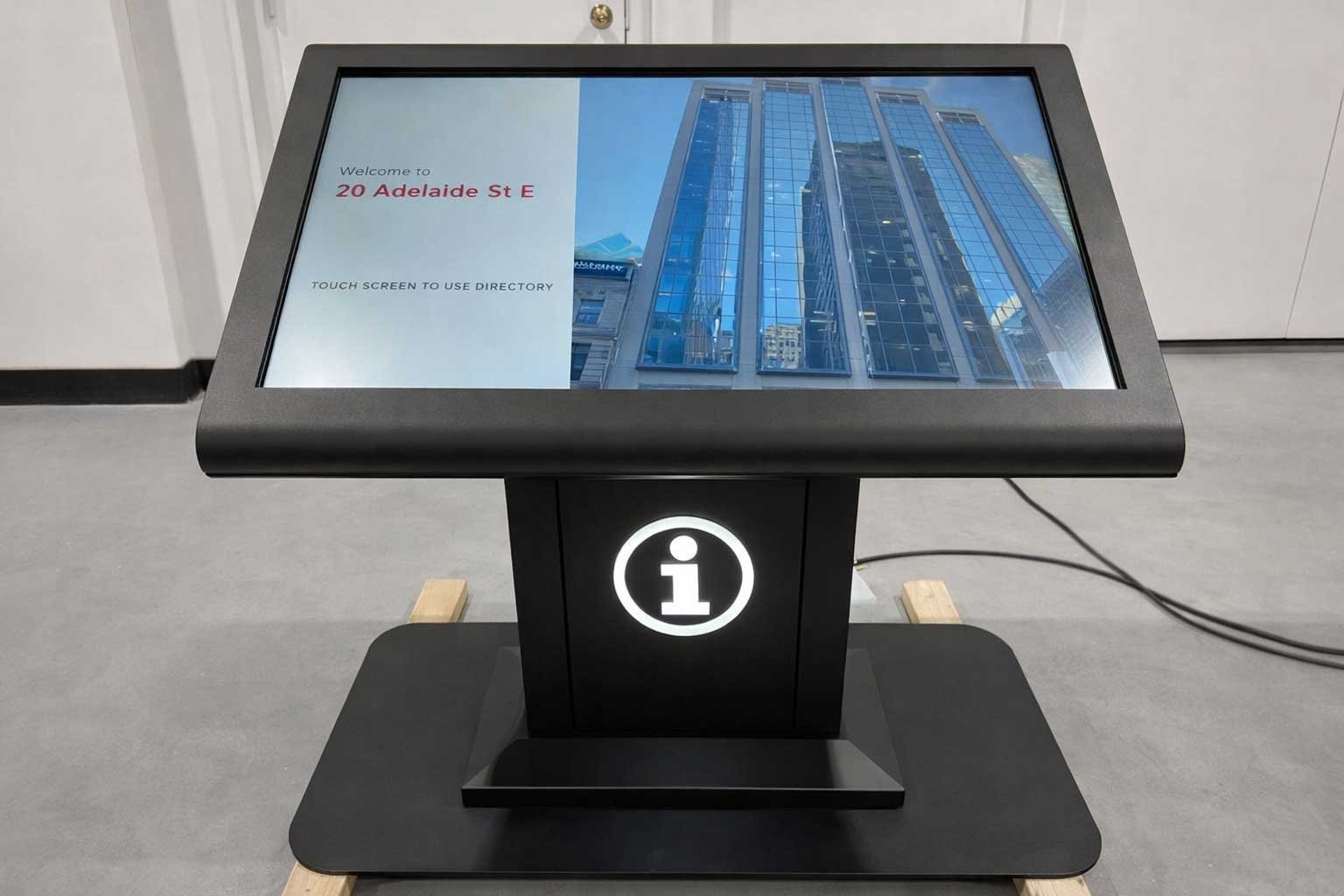 Front view of a custom indoor digital signage kiosk featuring a touchscreen directory and integrated metal enclosure by B&F Solutions Inc.