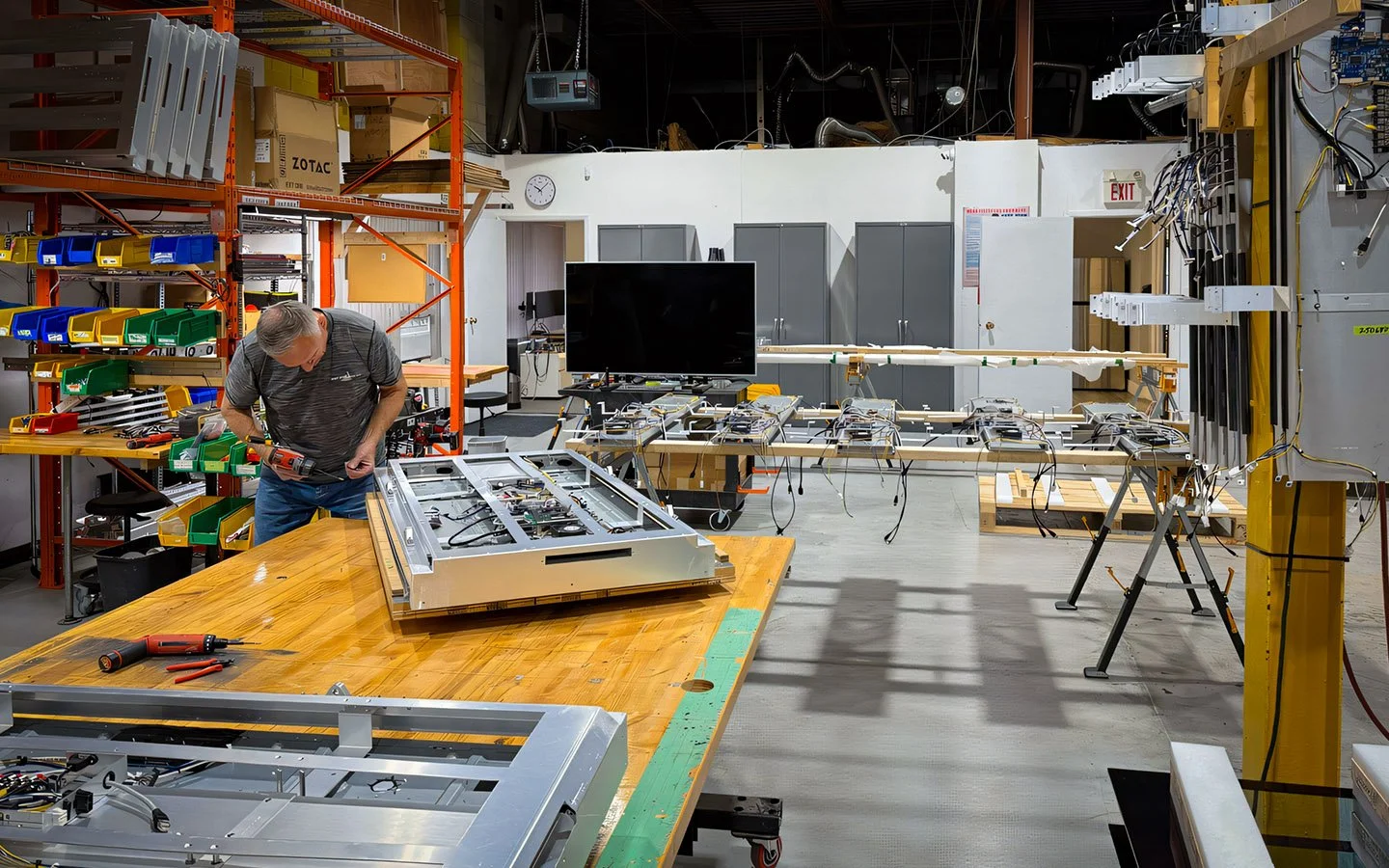Indoor digital signage unit on an assembly table inside B&F Solutions Inc’s manufacturing facility.
