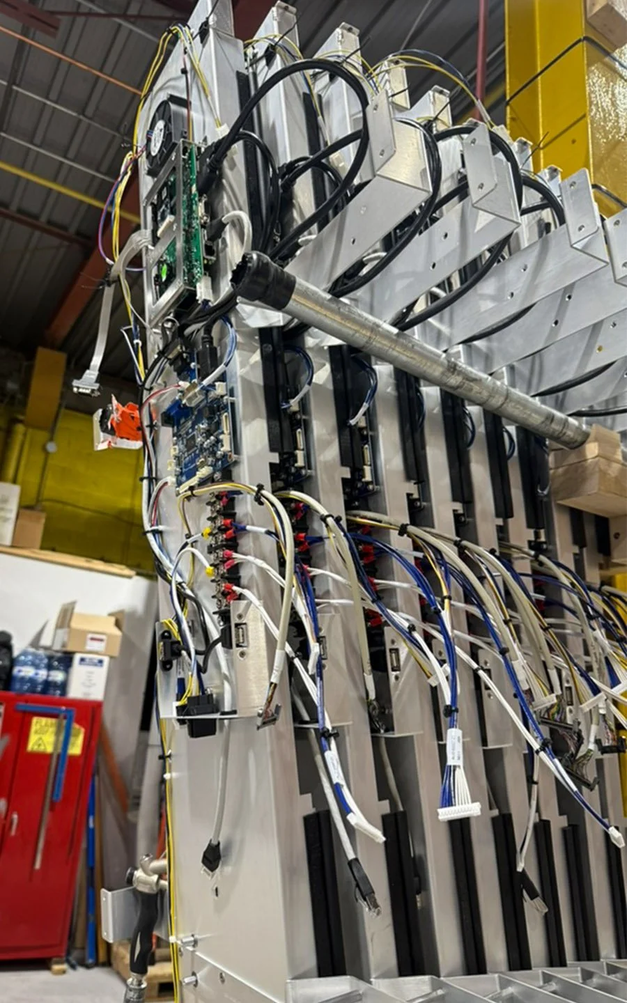 Rear view of vertically stacked indoor digital signage units with integrated electronics and organized wiring by B&F Solutions Inc.