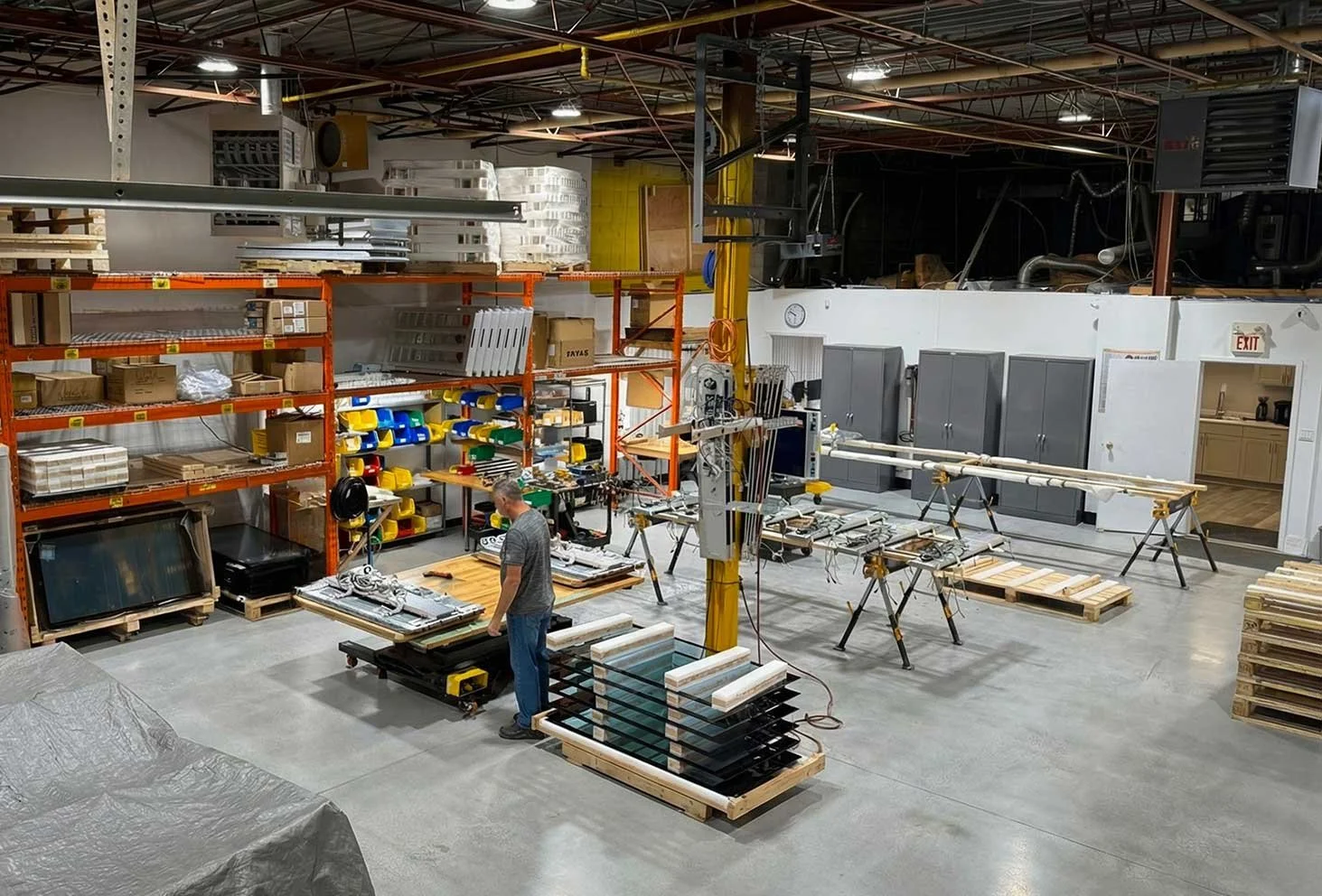 Overview of B&F Solutions Inc’s manufacturing floor showing signage assembly, fabrication, and staging processes.