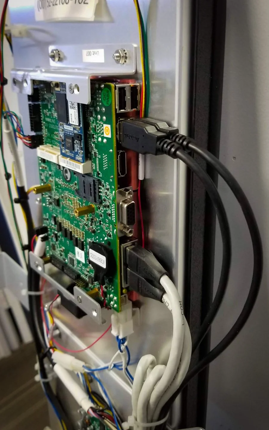 Close-up of control board, cabling, and connectivity installed inside an indoor digital signage enclosure by B&F Solutions Inc.