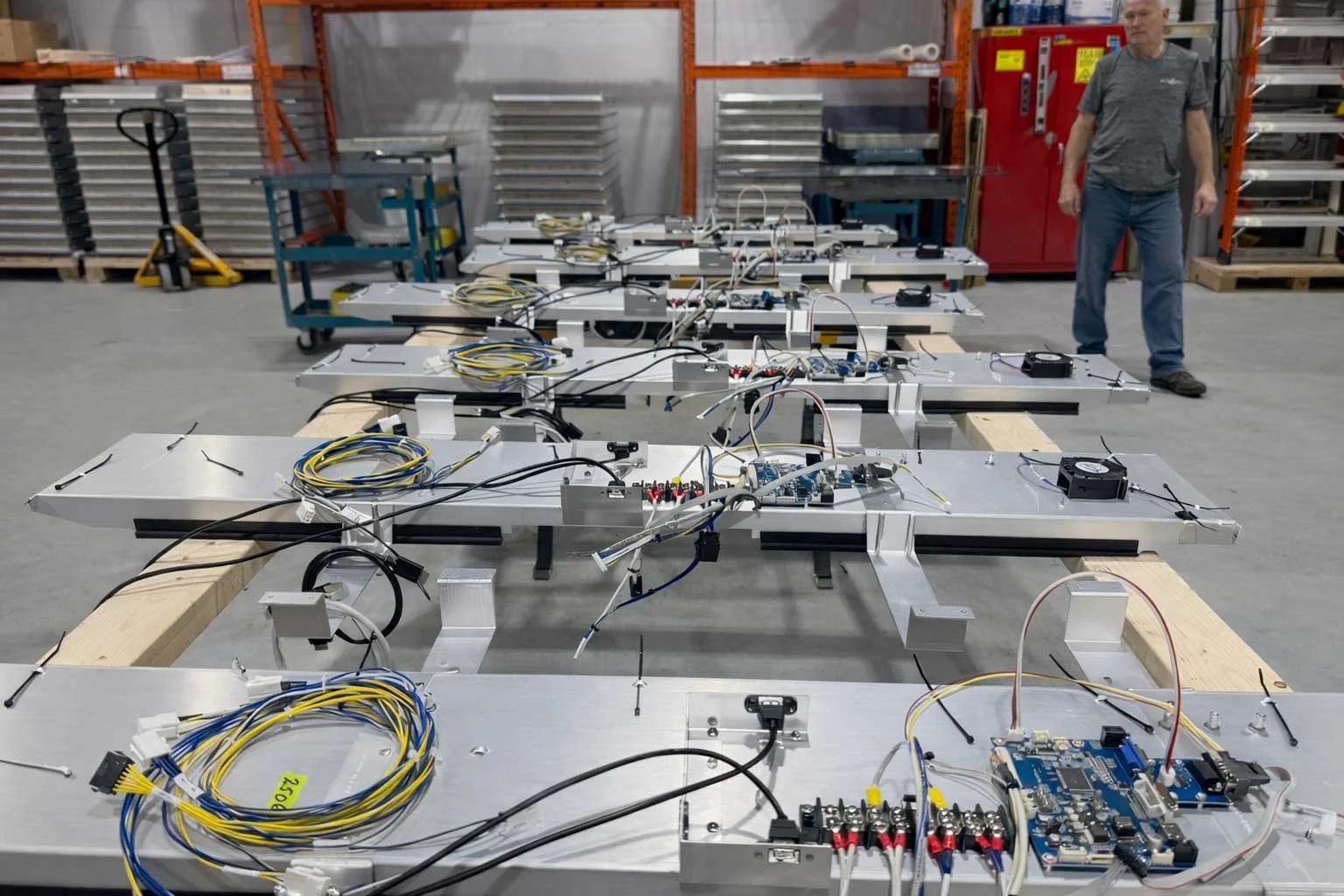 Multiple indoor digital signage units in parallel assembly, showcasing scalable production at B&F Solutions Inc.