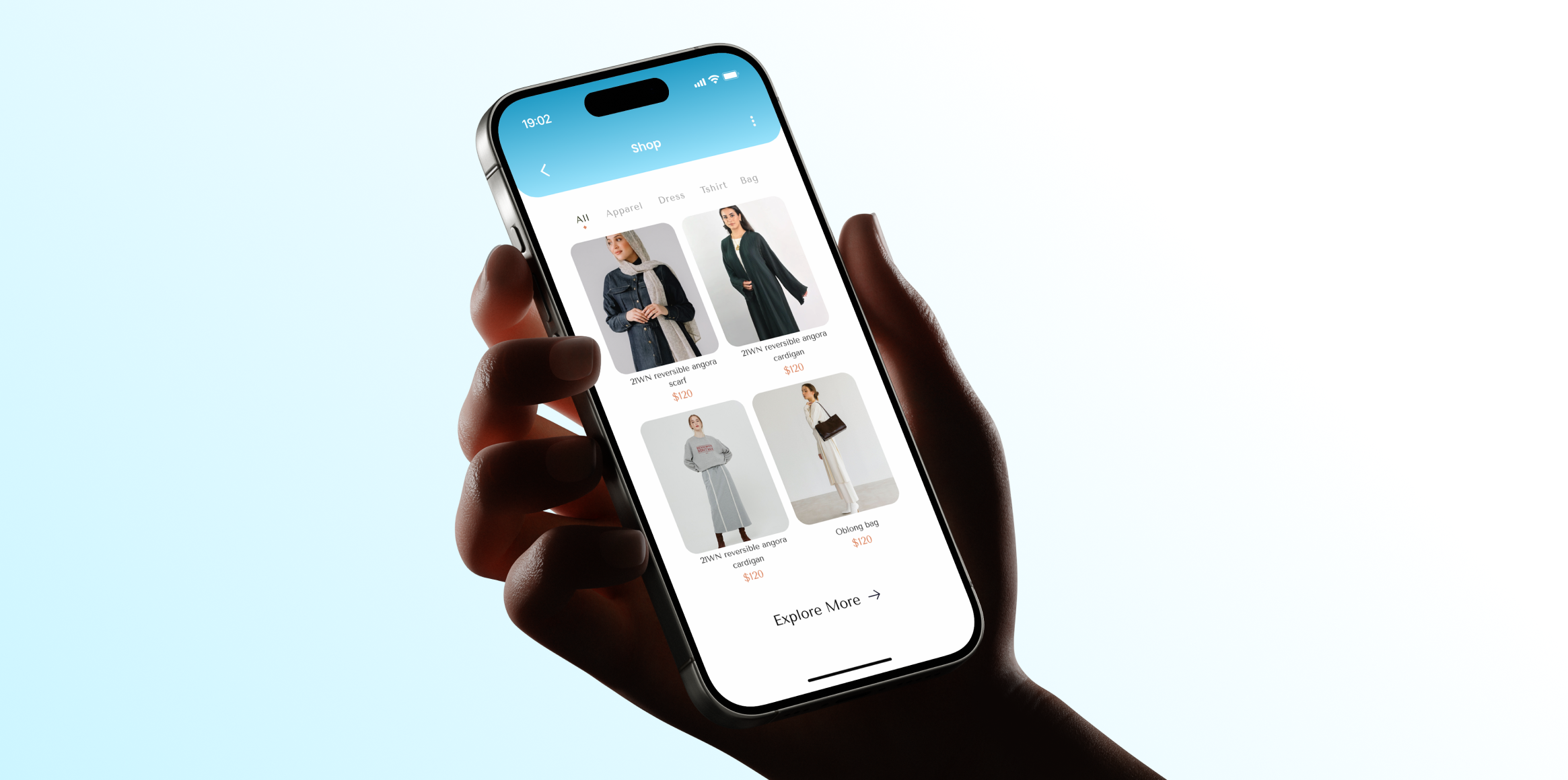 Close-up of a person's hand holding a smartphone displaying a fashion shopping app with images of women's clothing and accessories.