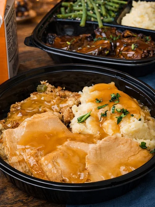 Goose Express takeout container with turkey, stuffing and mashed potatoes