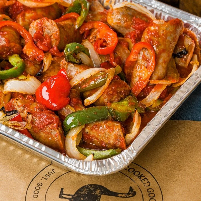 Italian sausage with bell peppers and onions in a sauce
